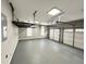 Spacious garage with three-car doors, shelving and high ceilings at 3545 Silver Vista Ct, Cumming, GA 30041