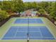 Aerial view of community tennis courts offering a great space for recreation, fitness, and community engagement at 3545 Silver Vista Ct, Cumming, GA 30041