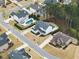 Aerial view highlighting homes with pools and manicured backyards, showcasing the community's appeal at 6635 Canyon Cv, Cumming, GA 30028