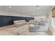 Large, bright finished basement with modern decor, comfortable sofas, and natural light at 6635 Canyon Cv, Cumming, GA 30028