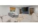 Spacious finished basement, with TV, modern lighting, window, large sofa and stylish decor at 6635 Canyon Cv, Cumming, GA 30028