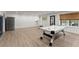 Finished basement with a stainless refrigerator, and an air hockey table with access to backyard at 6635 Canyon Cv, Cumming, GA 30028