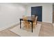 Finished basement dining area with table and four chairs at 6635 Canyon Cv, Cumming, GA 30028
