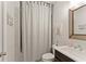 Stylish bathroom with shower, vanity, and decorative art at 6635 Canyon Cv, Cumming, GA 30028