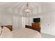 Bedroom with carpet, TV, chandelier, and two closets at 6635 Canyon Cv, Cumming, GA 30028