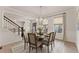Formal dining area featuring a stylish table setting and natural light at 6635 Canyon Cv, Cumming, GA 30028