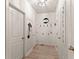 Bright hallway features coat rack and 'sweet tea' sign at 6635 Canyon Cv, Cumming, GA 30028