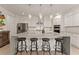 Gourmet kitchen with a large island and stainless steel appliances at 6635 Canyon Cv, Cumming, GA 30028