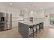 Gourmet kitchen with a large island and stainless steel appliances at 6635 Canyon Cv, Cumming, GA 30028