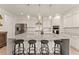 Modern kitchen boasts sleek countertops, stainless steel appliances, and ample storage space at 6635 Canyon Cv, Cumming, GA 30028