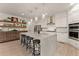Gourmet kitchen with a large island and stainless steel appliances at 6635 Canyon Cv, Cumming, GA 30028