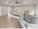 Spacious primary bedroom with sitting area, bed, lamps, and hardwood floors at 6635 Canyon Cv, Cumming, GA 30028