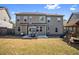 Large backyard with a patio set, a playset, and a well-maintained lawn at 2195 Well Springs Dr, Buford, GA 30519
