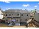 View of the back exterior of the home featuring a patio and play area at 2195 Well Springs Dr, Buford, GA 30519
