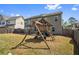 Spacious backyard featuring a wooden playset, a patio with a table, and lots of room to play at 2195 Well Springs Dr, Buford, GA 30519