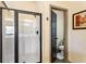 Bathroom features a glass enclosed shower and a view of a toilet behind the door at 2195 Well Springs Dr, Buford, GA 30519