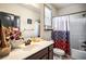 Bathroom with vanity, sink, and decorative accents; features a shower with a patterned curtain at 2195 Well Springs Dr, Buford, GA 30519