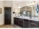 Bathroom features a double sink vanity, dark cabinets, and tile flooring at 2195 Well Springs Dr, Buford, GA 30519