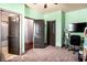 Spacious bedroom with multiple doors, carpeted flooring, and a desk area, offering comfort and functionality at 2195 Well Springs Dr, Buford, GA 30519