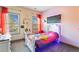 Bright bedroom featuring a white sleigh bed, colorful accents, and dual windows for lots of natural light at 2195 Well Springs Dr, Buford, GA 30519