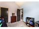 Spacious bedroom featuring a bookshelf, a desk, and view to the hallway at 2195 Well Springs Dr, Buford, GA 30519