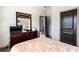 Bedroom features a full dresser with a mirror and a window for lots of natural light at 2195 Well Springs Dr, Buford, GA 30519