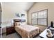 Cozy bedroom with a large window, plush bedding, and modern decor at 2195 Well Springs Dr, Buford, GA 30519