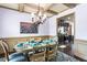 Beautiful dining room with decorative chandelier and wainscoting, perfect for Gathering gatherings and entertaining at 2195 Well Springs Dr, Buford, GA 30519