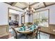 Charming dining room featuring a large window and stylish decor, adjacent to a comfortable sitting area at 2195 Well Springs Dr, Buford, GA 30519