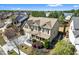Aerial view of home with well-maintained landscaping and inviting front porch at 2195 Well Springs Dr, Buford, GA 30519