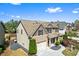 Two-story home with a landscaped front yard, showcasing the property's inviting exterior at 2195 Well Springs Dr, Buford, GA 30519