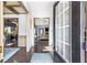 Inviting foyer with hardwood floors leads to an open-concept living space and kitchen with stainless steel appliances at 2195 Well Springs Dr, Buford, GA 30519