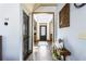 Bright hallway featuring hardwood floors and stylish decor, connecting various rooms of the home at 2195 Well Springs Dr, Buford, GA 30519