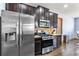 Modern kitchen with stainless steel appliances, granite countertops, and stylish backsplash, ideal for cooking and entertaining at 2195 Well Springs Dr, Buford, GA 30519