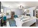 Inviting living room with a cozy fireplace, large sectional sofa, and staircase leading to the upper level at 2195 Well Springs Dr, Buford, GA 30519