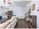 Open-concept living room with a staircase, hardwood floors, and built-in bookcases for ample storage at 2195 Well Springs Dr, Buford, GA 30519