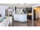 Open-concept living space with a partial kitchen view, perfect for modern living and entertaining guests at 2195 Well Springs Dr, Buford, GA 30519