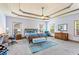 Large main bedroom features tray ceilings, a ceiling fan, and plenty of natural light at 2195 Well Springs Dr, Buford, GA 30519
