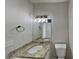Bathroom featuring granite countertop, modern fixtures, and ample lighting at 3245 Country Walk Dr, Powder Springs, GA 30127
