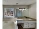 Bright bathroom featuring double vanity with granite countertops and a soaking tub near a large window at 3245 Country Walk Dr, Powder Springs, GA 30127