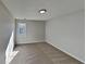 Bedroom with neutral carpet, a window that provides ample natural light, and a flush-mount ceiling light at 3245 Country Walk Dr, Powder Springs, GA 30127
