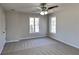 Spacious bedroom with neutral paint, carpet, ceiling fan, and two windows at 3245 Country Walk Dr, Powder Springs, GA 30127