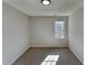 Bedroom with neutral carpet, a window that provides ample natural light, and a flush-mount ceiling light at 3245 Country Walk Dr, Powder Springs, GA 30127