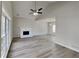 Bright living room with vaulted ceiling, fireplace, ceiling fan, and beautiful hardwood floors at 3245 Country Walk Dr, Powder Springs, GA 30127