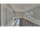 The room features wood-look flooring, a large window, a closet, and a glass door at 3245 Country Walk Dr, Powder Springs, GA 30127