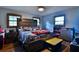Comfortable bedroom with a unique wooden headboard, ample natural light, and cozy decor at 3526 Highway 11 S, Mansfield, GA 30055