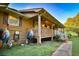 This home has a charming porch with a white railing and a well-manicured lawn at 3526 Highway 11 S, Mansfield, GA 30055