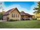 Charming exterior view of the home with a well-maintained lawn and inviting front porch at 3526 Highway 11 S, Mansfield, GA 30055