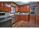Modern kitchen features stainless steel appliances, laminate countertops, and hardwood-style floors at 3526 Highway 11 S, Mansfield, GA 30055