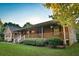 Inviting front porch with wood railing, offering a relaxing outdoor space at 3526 Highway 11 S, Mansfield, GA 30055
